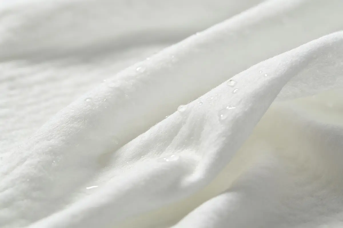 Close up of soft baby wipe fabric texture with water droplets