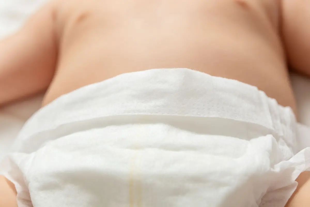 Hypoallergenic baby diaper close up showing soft top sheet with baby