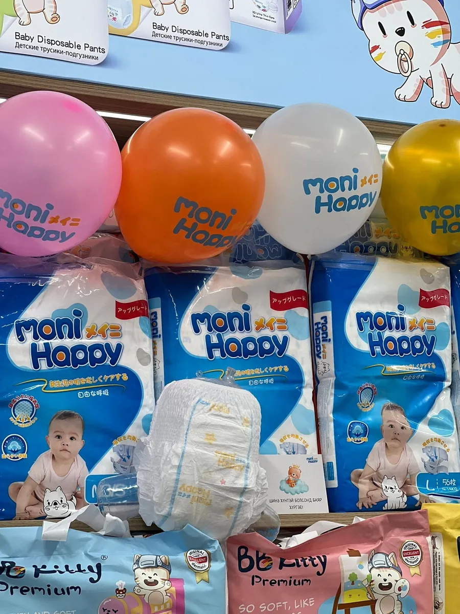 Moni Happy packs with brand balloons on a retail shelf in Mongolia